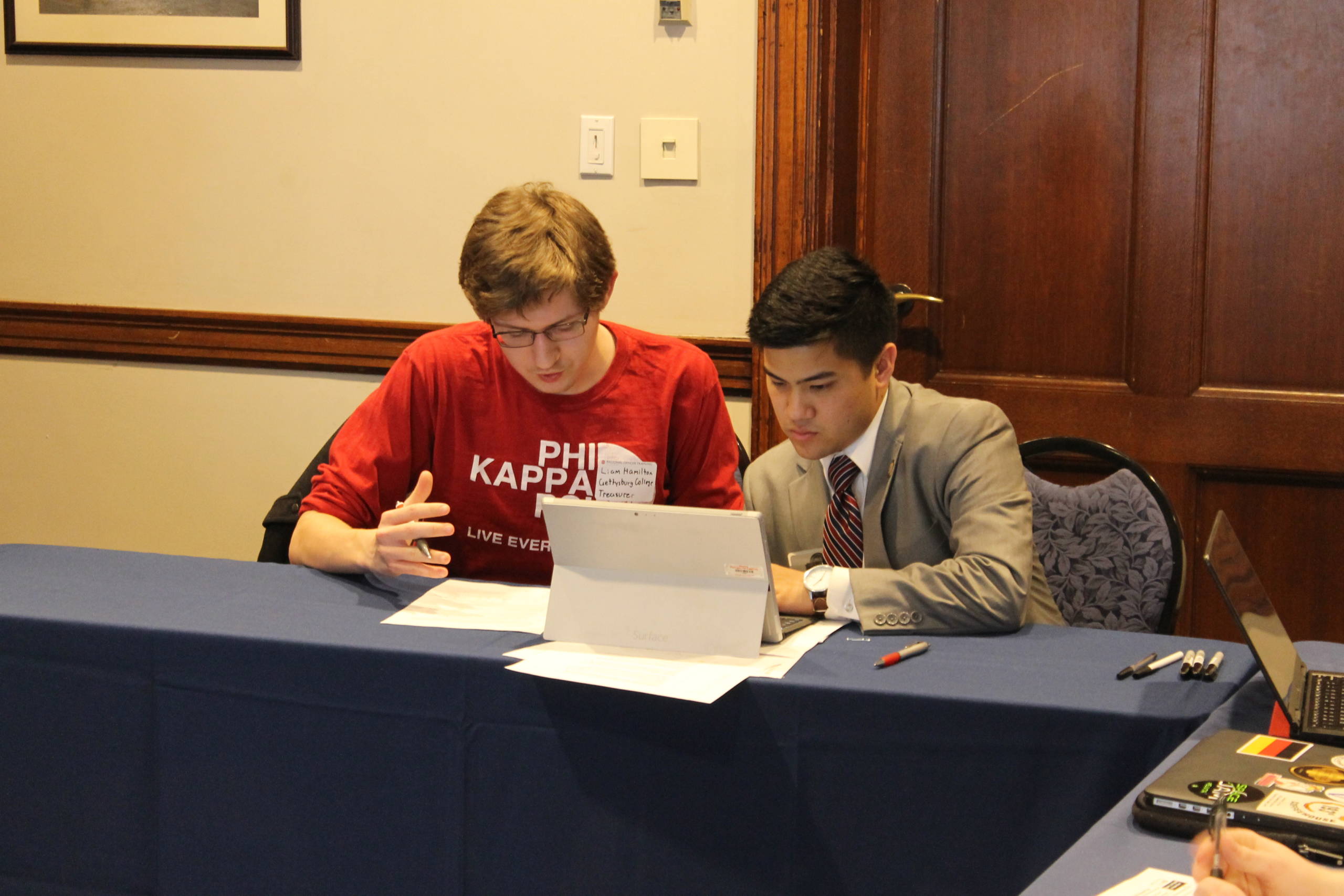 Two Phi Psis sitting at computer